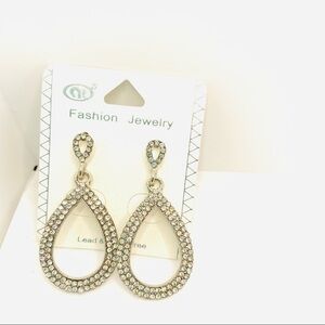 Earrings Crystal tear drop Pierced set in silver tone.